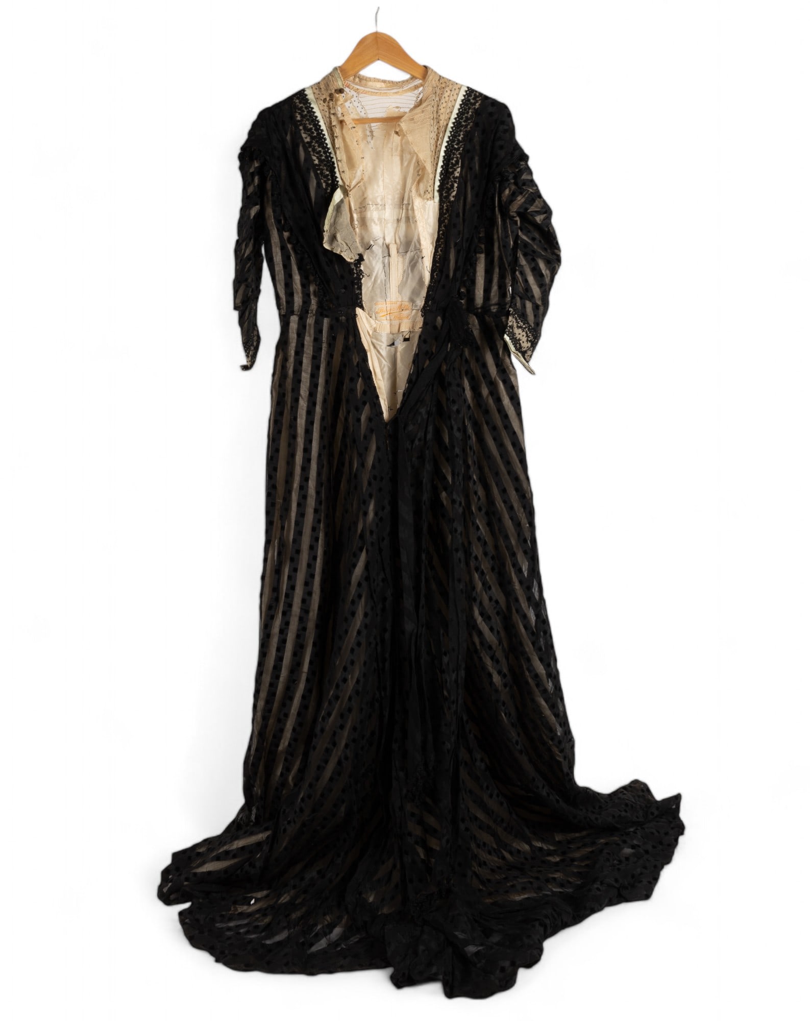 19th C Bina Mette Black Lace Dress: A late 19th C. Victorian English black lace dress with label Bina Mette of 30 Old Square in Warwick, England. Dress needs some restoration as seen in photography.