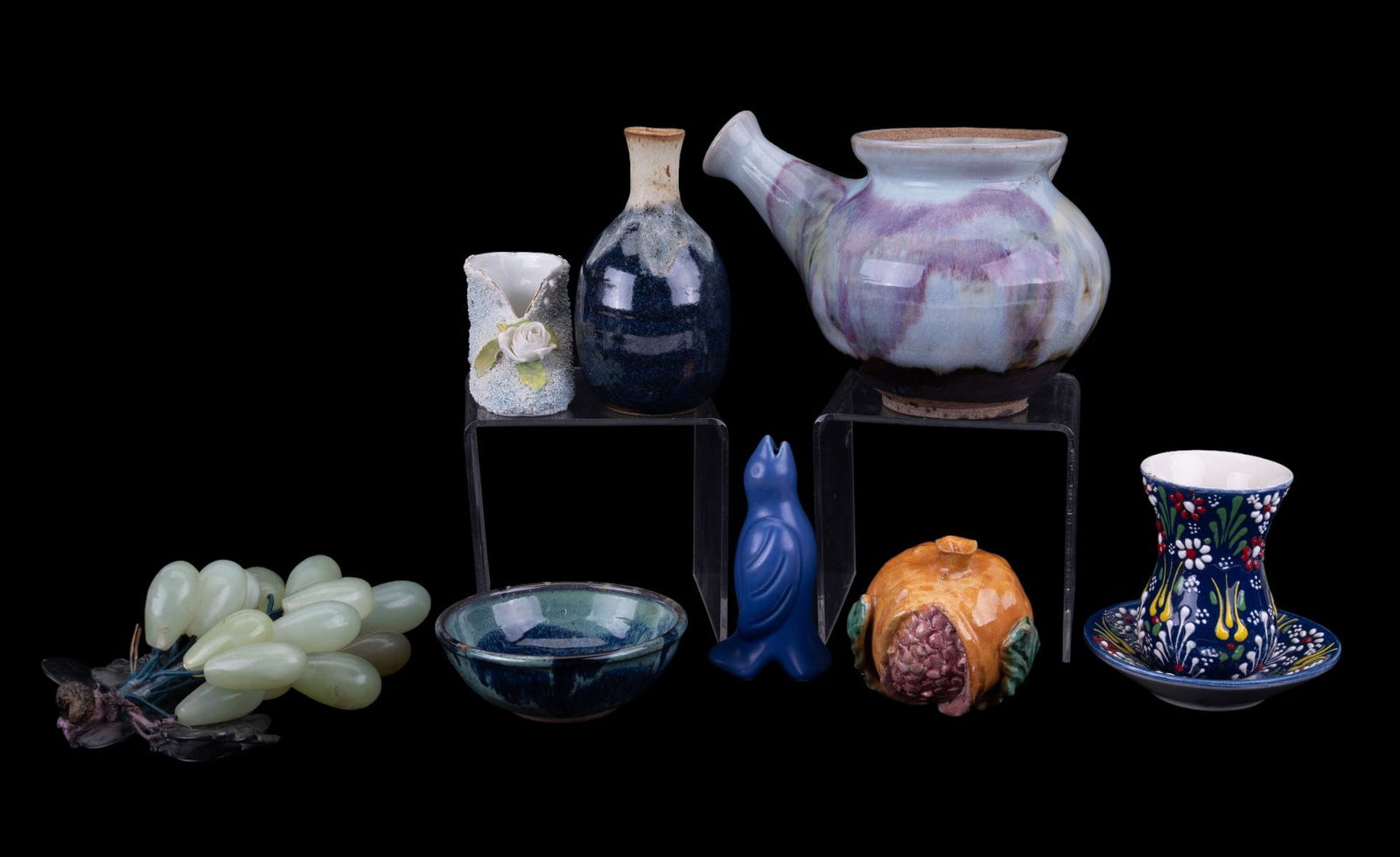 Artisan Stoneware Pottery + Stone Fruit: A Seaward Pottery Raku teapot, a Raku bud vase measuring approx. 4.75" high, a redware blue drip glaze bowl signed: "Barbadas" with a 4" diameter, a stoneware pomegranate with tiny chip, a porcelain s