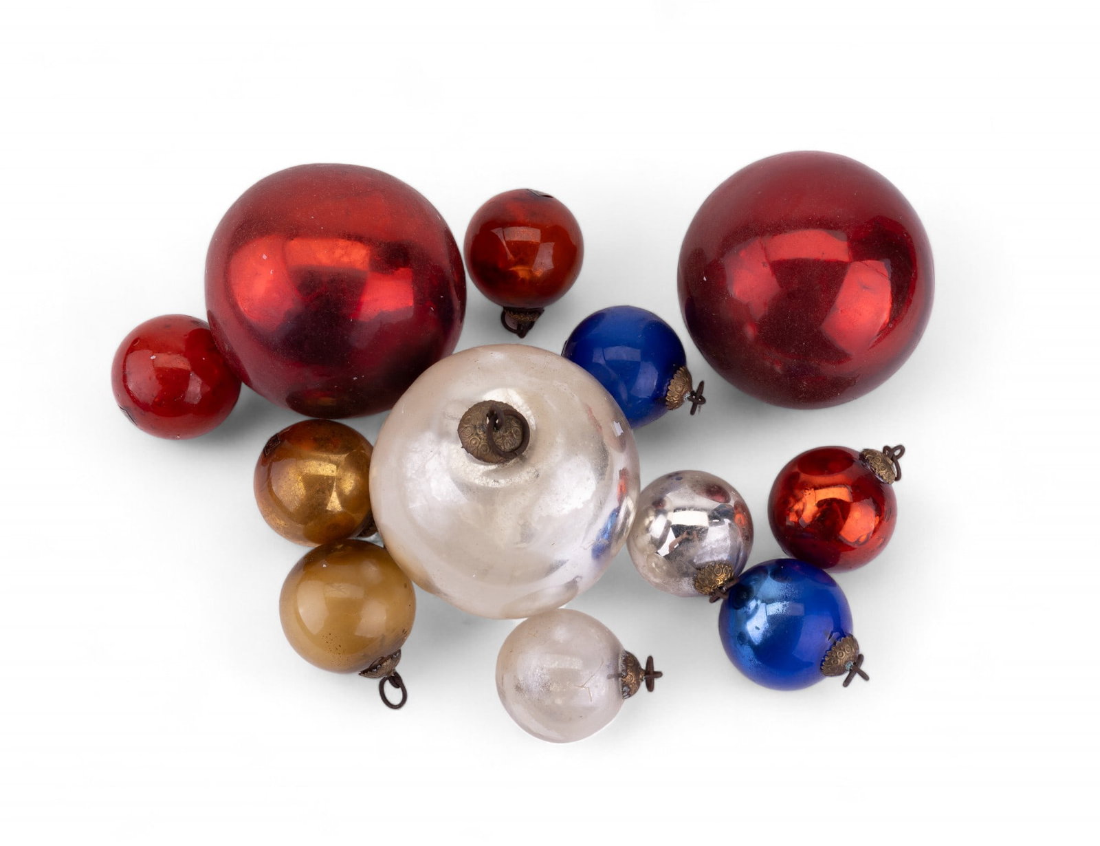 Vintage Christmas Tree Balls: Vintage Christmas tree ball ornaments made of thick glass. 120 of them measure approx 1.75" in diameter and 3 measure approx 3.75" in diameter. Ornaments come in a variety of colors (red, green, blue,