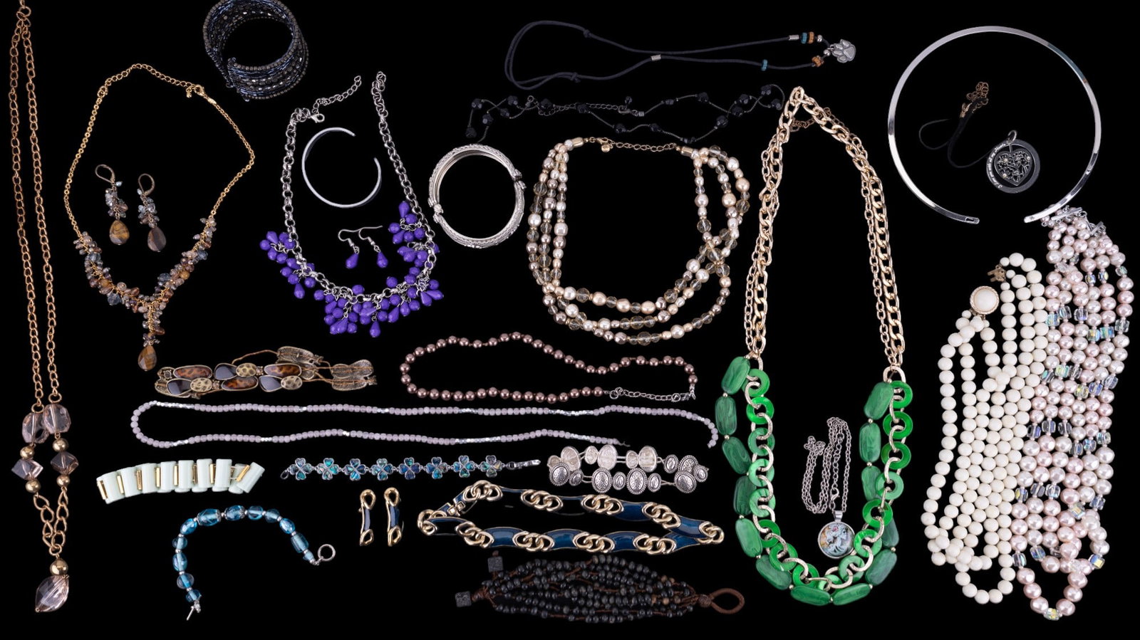 Napier, J Crew, Lia Sophia & More Costume Jewelry: Napier silvertone bracelet, Lia Sophia goldtone with black and brown bracelet, and a J Crew goldtone and green beaded bracelet. Lot also includes a bone necklace, a white beaded necklace marked "Japan