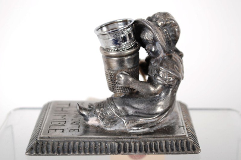 Victorian Thimble Holder: Victorian silver plated thimble holder by Miller Silver Company, Kate Greenway Girl, seated, titled "My Favorite Thimble"