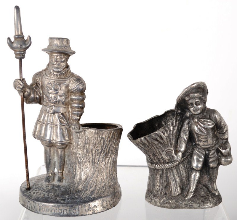 Two Toothpick Holders: Two silver plated toothpick holders including a Yeoman of the guard (Beefeater) and a boy standing by a sheaf of wheat