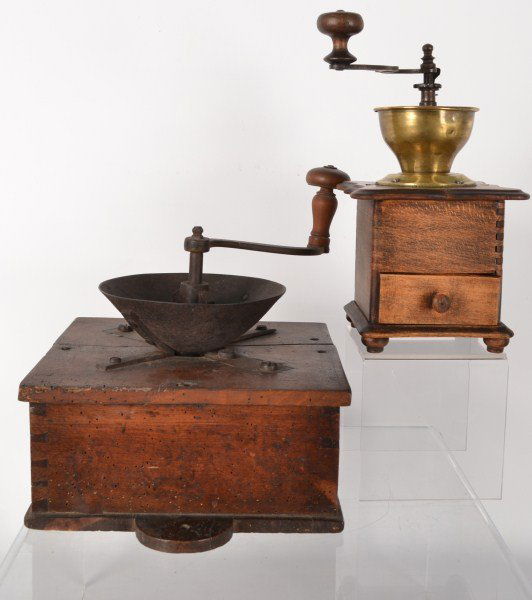 Two Coffee Grinders: Two coffee grinders: one is c 1820 and has a cast iron hopper and has half moon tabs on the base, the other is c 1880 and has a brass hopper