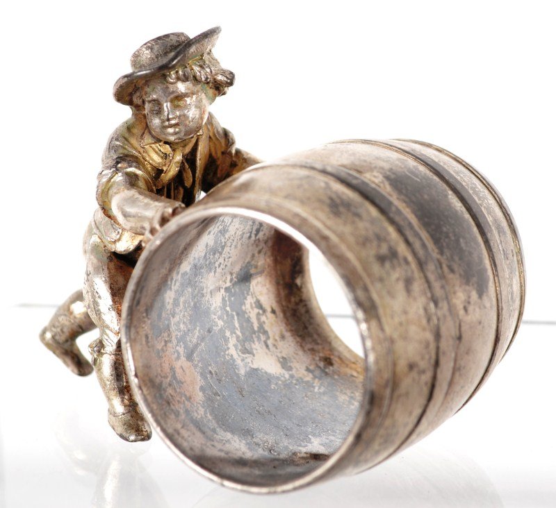 Victorian Figural Napkin Ring: Victorian silver plate figural napkin ring with Kate Greenaway-type boy pushing a barrel