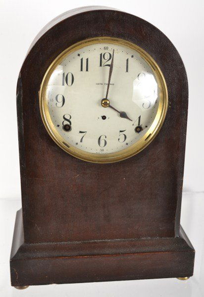 Mahogany Arch Top Clock by Seth Thomas c 1900: Mahogany arch top clock by Seth Thomas c 1900 with brass rims and feet; has key