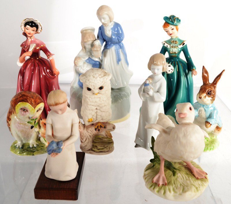 Assortment of figurines including a Lladro' Reclin: Lladro Reclining Cherub. Beatrix Potter's "Peter Rabbit", 2 Coalport Ladies of Fashion and more