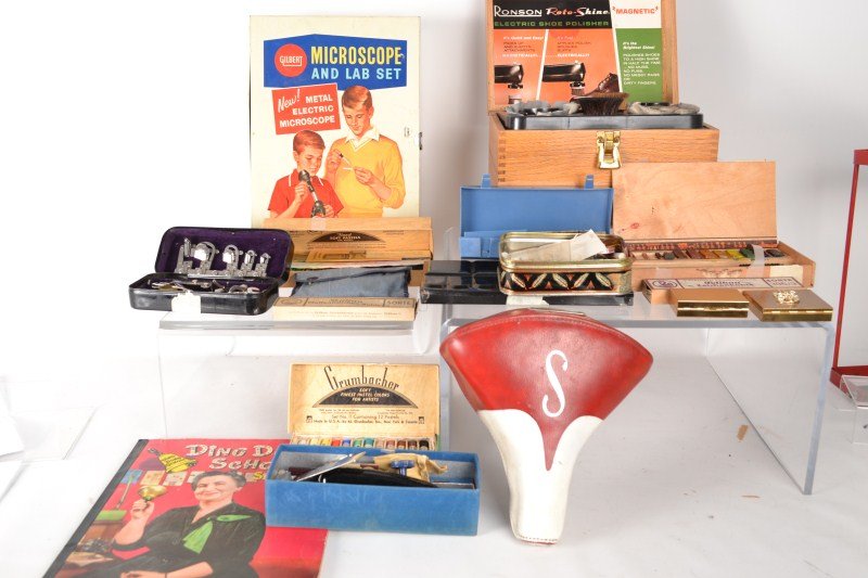 Grouping of Educational Items: Educational items including a Microscope Lab set by the A.C.Gilbert Company (has a microscope, is in a metal box) "Ding Dong School" scrapbook, pencils and pens, Schwinn bicycle seat, 60's sewing kit,