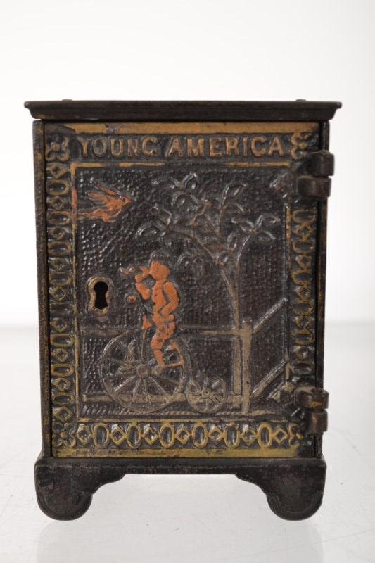 Cast Iron Still Bank: Cast Iron Still Bank "Young America" by Kyser and Rex, c 1882,