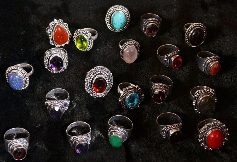 Silver-Tone Rings: Silver-tone rings; twenty rings with various stones, some marked 925 but tested as not sterling