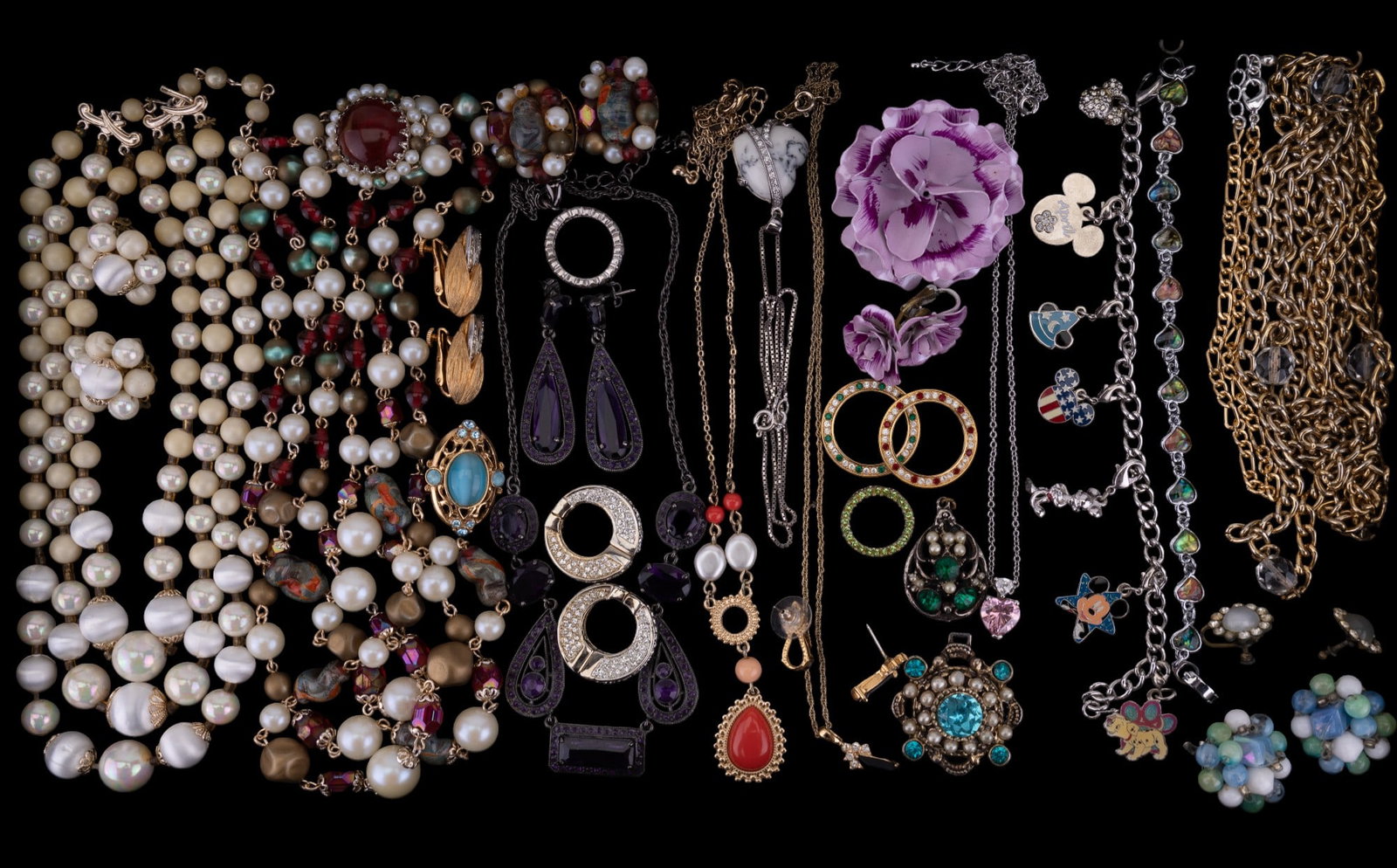 Quality Bead, Rhinestone, Crystal Costume Jewelry: Grouping of costume jewelry, including two quality beaded necklace & earring sets, a purple rhinestone necklace & earrings set, flower brooch w/ earrings, panel & charm bracelets, black stone necklace