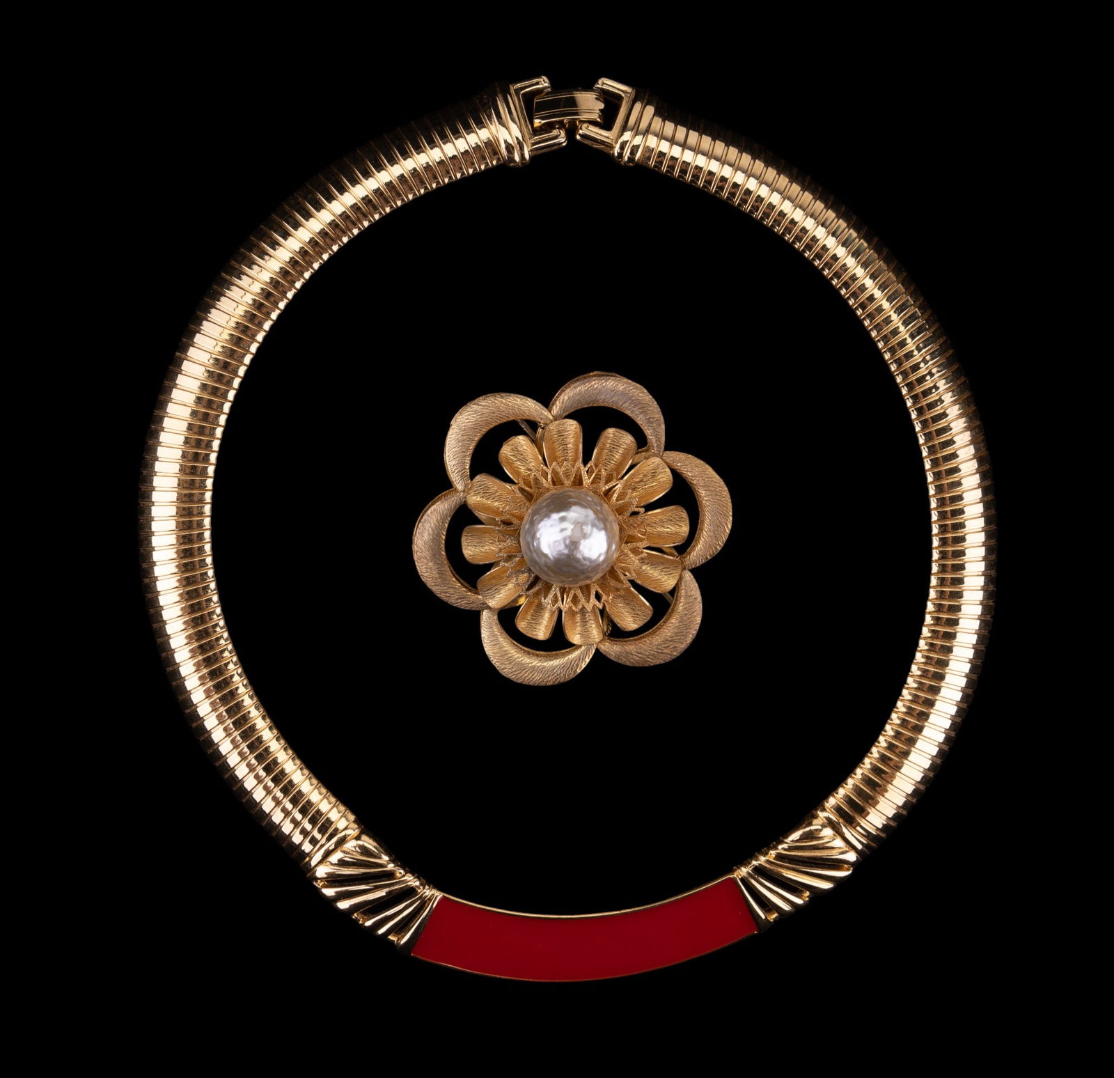 Miriam Haskell Goldtone Flower Brooch, Monet: A Miriam Haskell signed gold tone flower brooch with faux pearl center, along with a gold tone red enamel collar Monet necklace.