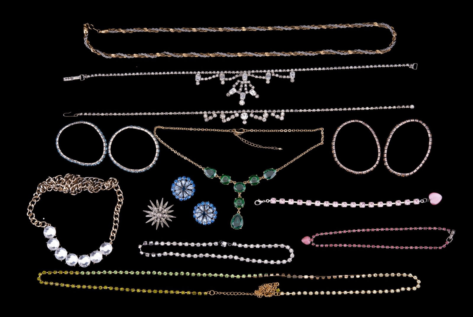Rhinestone Jewelry: Multi-colored rhinestone jewelry grouping including stretchy bracelets, rhinestone clasped bracelets, two clear rhinestone necklaces, blue crystal/rhinestone necklace, two ton chain & more.
