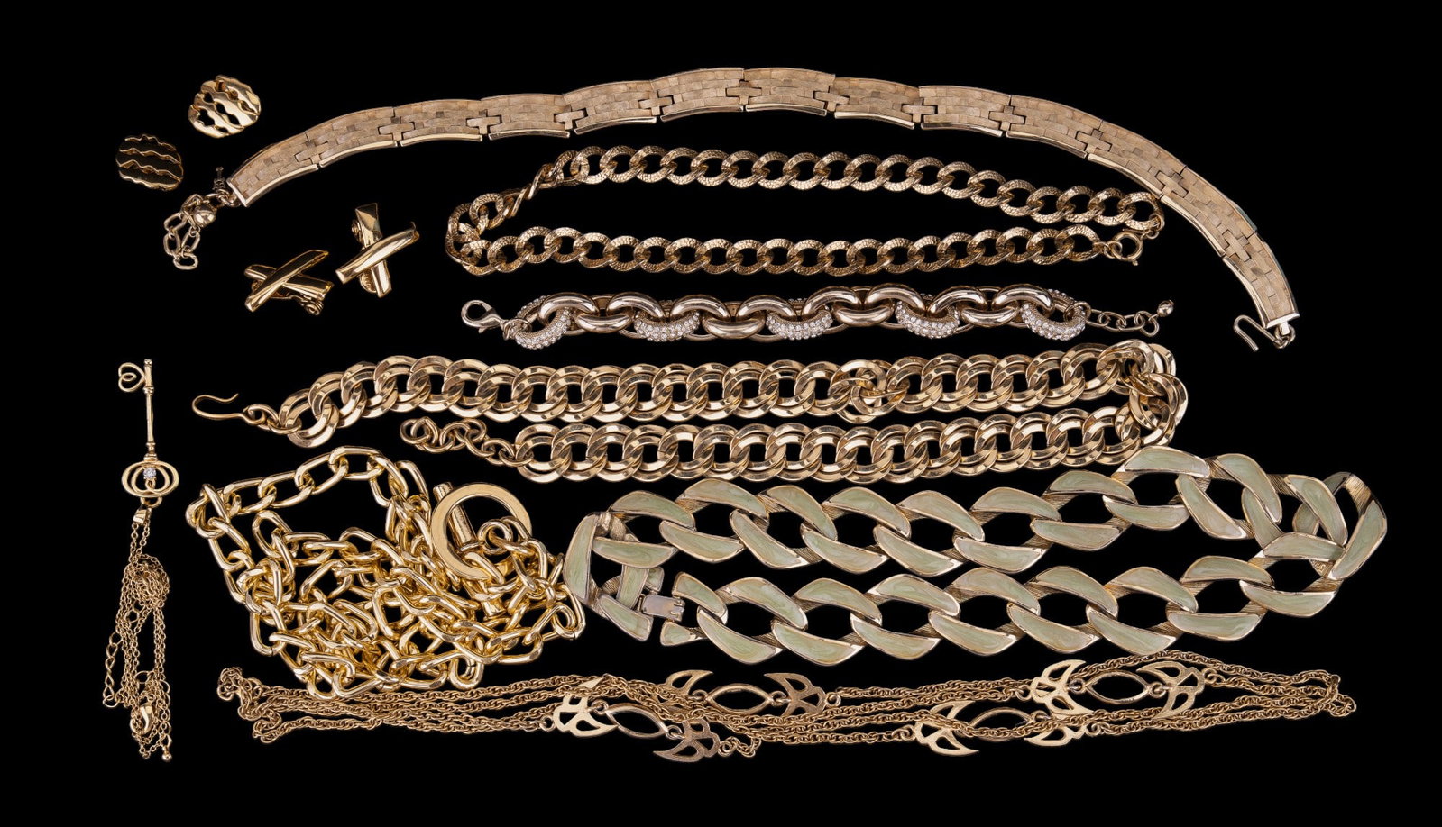Monet, Trifari, Gold Tone Costume Jewelry: Two Monet gold tone chain necklaces, a Trifari textured gold tone necklace, Trifari gold tone earrings, Monet gold tone "X" earrings, gold tone chain with key pendant marked "NVC" & more.