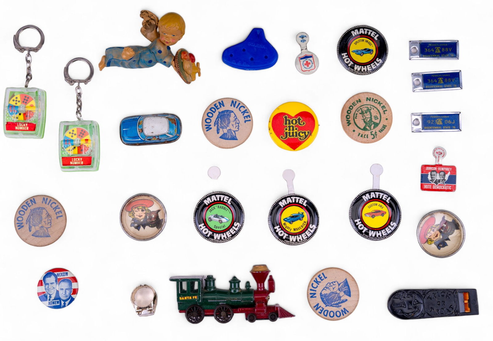 Vintage Political Pins, Advert. Buttons & more: Grouping includes vintage die cast toys & wind up cars, four Mattel Hot Wheels pins, multiple wooden nickels, Johnson Humphrey & Nixon Agnew political pins & more.