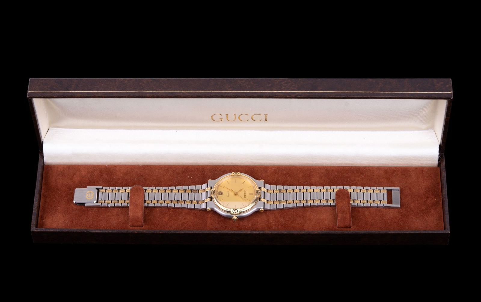 Gucci 9000M Wristwatch with Original Box: Gucci 9000M model two-tone wristwatch with Swiss made quartz movement measuring approx. 7.5" L. Watch is untested and includes original packaging.