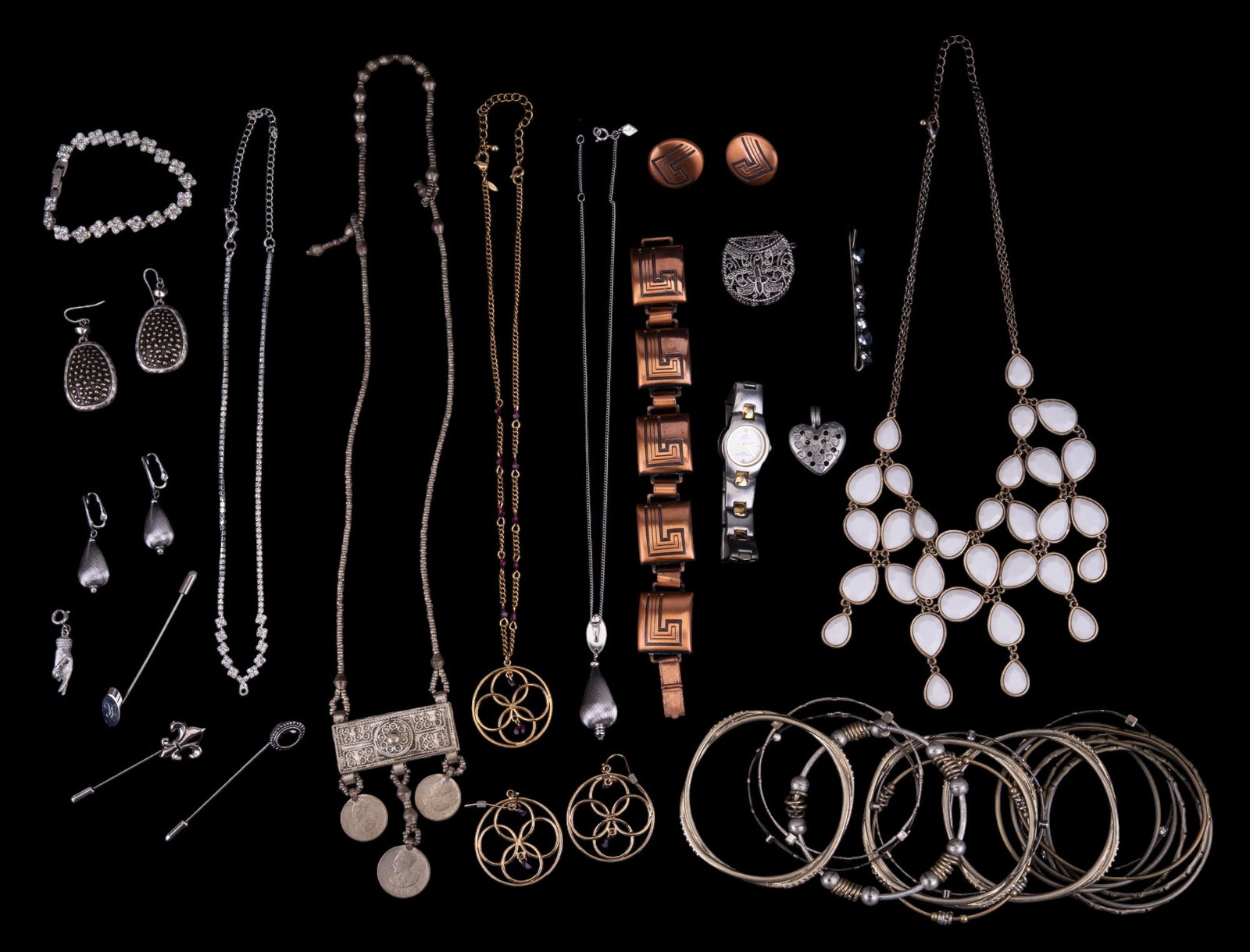 Assorted Fashion Jewelry: Fashion jewelry including silver, gold, and copper tone necklaces, bangles, charms, pendants, earrings, pins, and more; some pieces by Sarah Coventry.