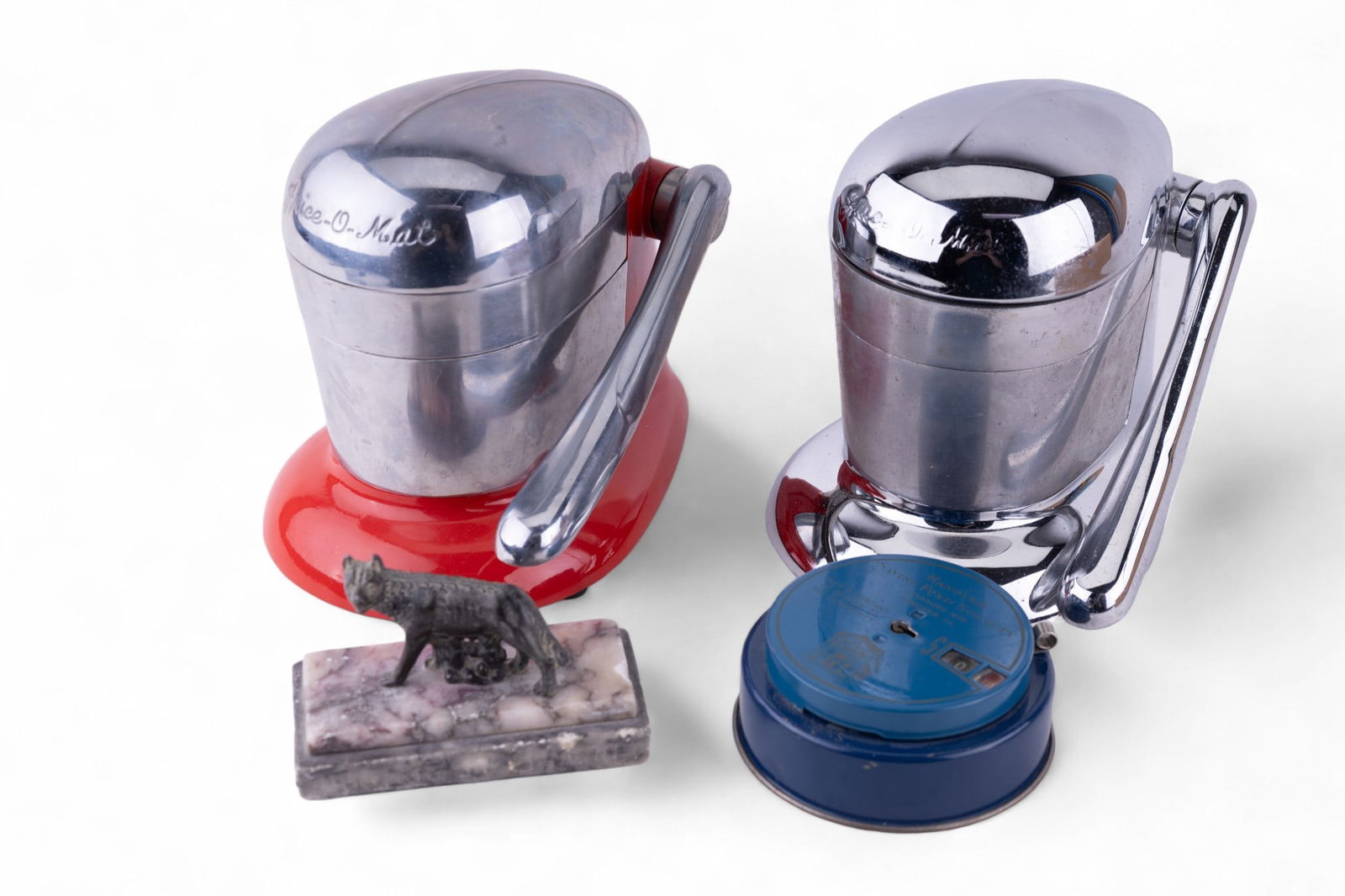 Vintage Coin Bank, Decorative Items, Kitchenware: Grouping includes a vintage Hanover Saving Fund Society with a counting function, two vintage "Juice-O-Matic" lever juicers, along with a small marble/granite base Romulus & Remus statue.