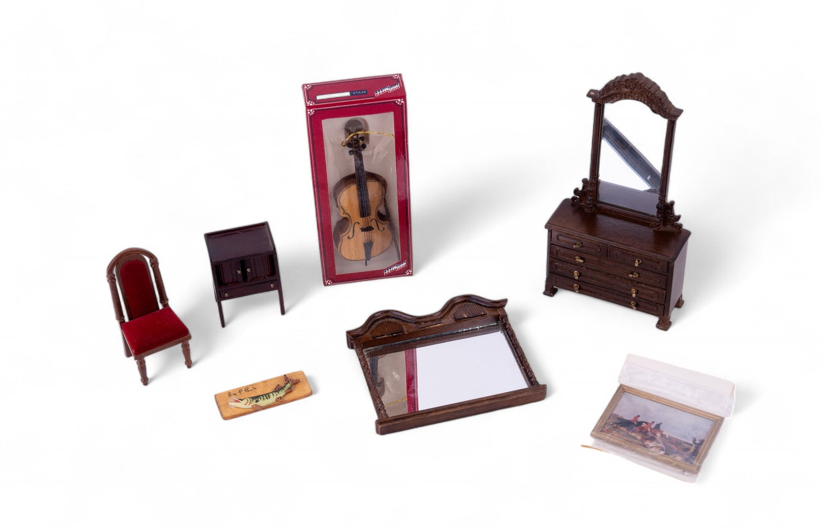 Dollhouse Furniture Grouping: Grouping includes a Promite brand cello in original packaging, Alessio Miniatures painting of men playing polo (original packaging), Bespaq Dresser w/ tall mirror, miniature porcelain fish, Bespaq tab