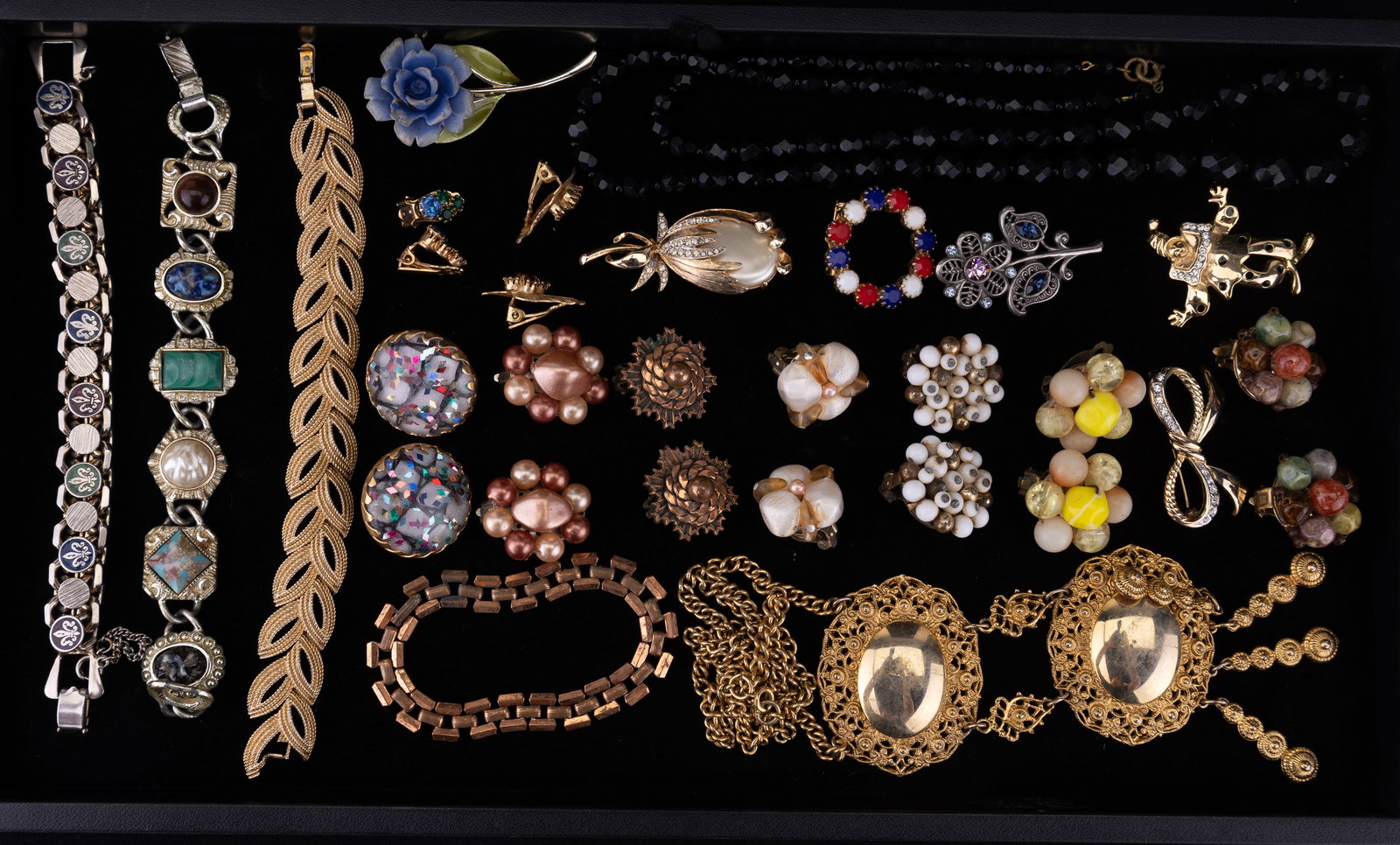 Trifari Gold Tone and Vintage Jewelry: Collection includes Trifari leaf design vintage bracelet, several pairs of clip earrings including confetti style, Sarah Coventry bracelets, necklaces, pins, and more.