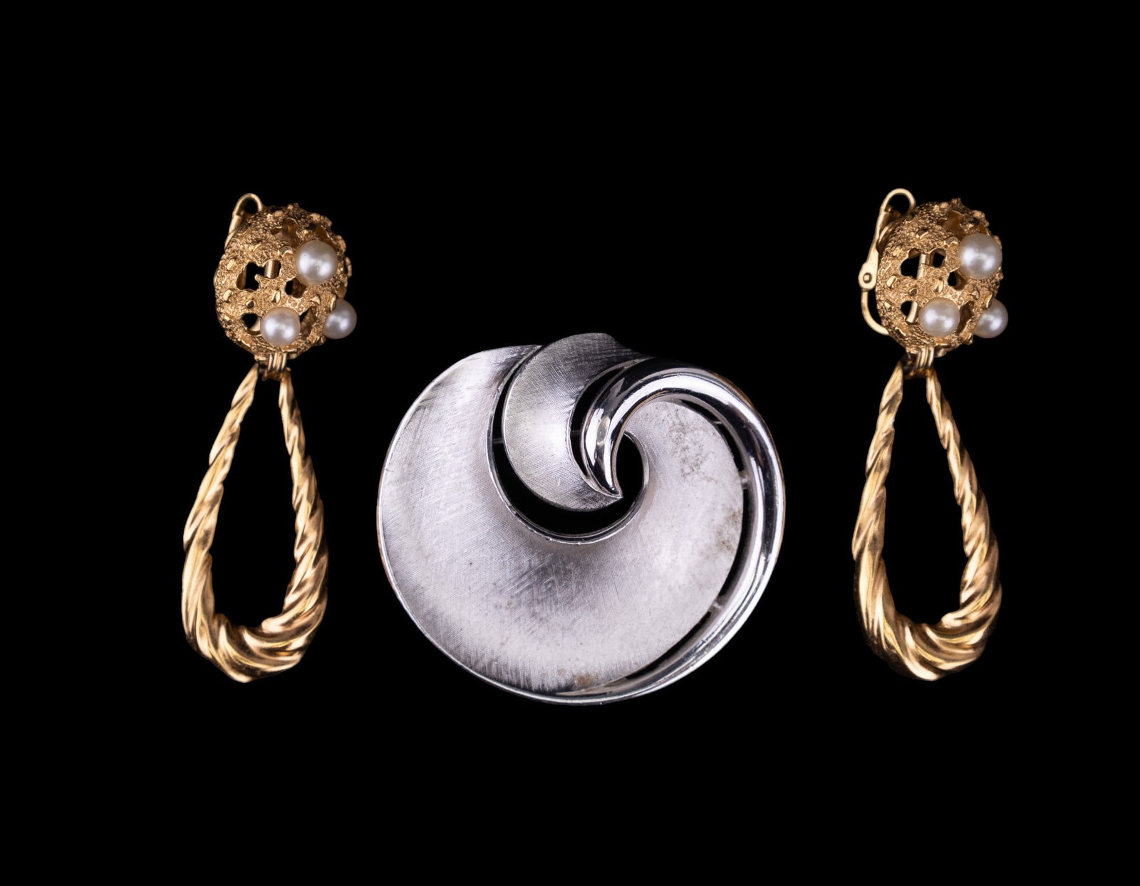Trifari Vintage Jewelry: Trifari signed circa 1960s - 70s silver tone brooch and gold tone drop clip earrings.