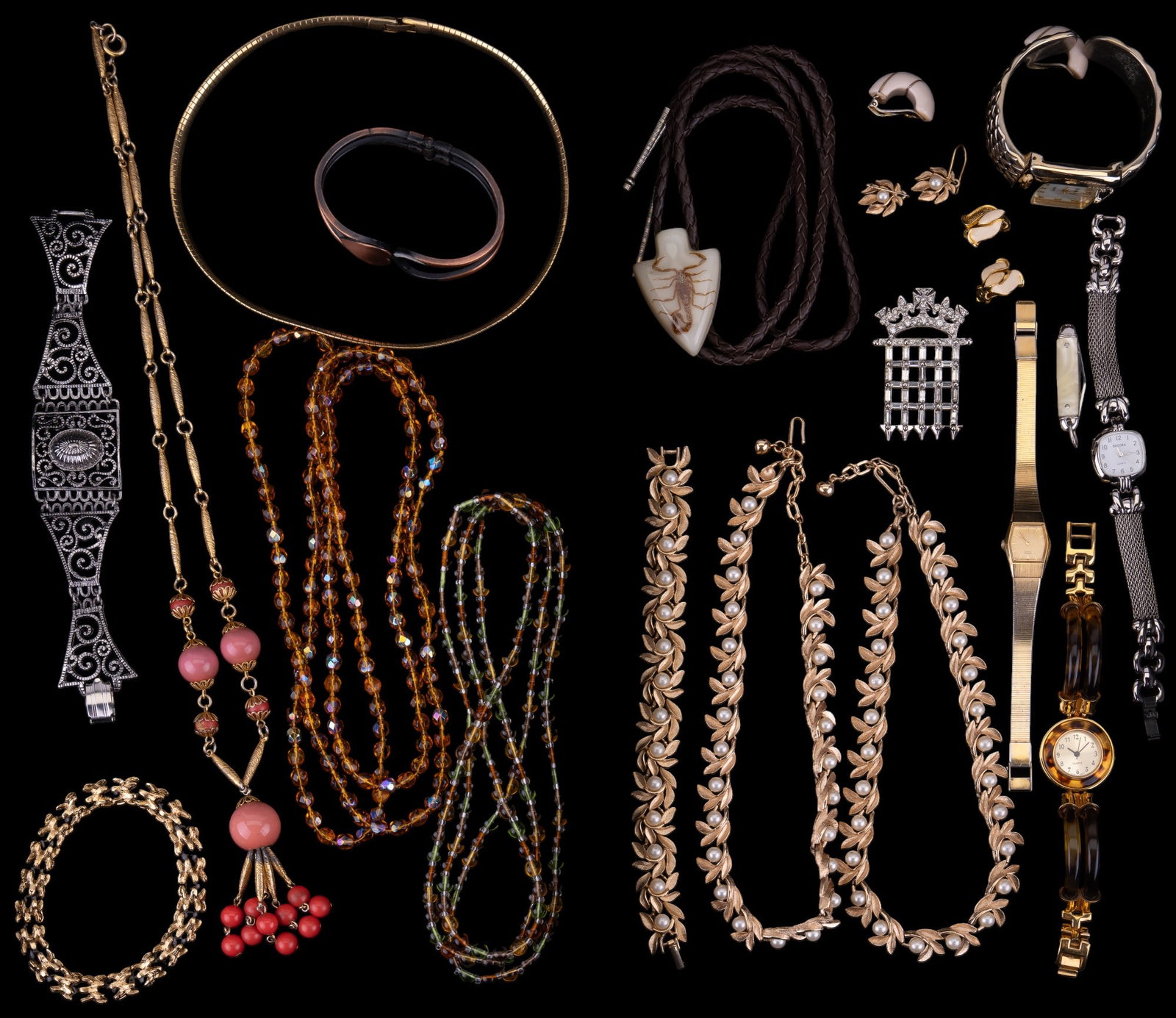 Vintage Estate Jewelry: Various vintage jewelry including encased scorpion arrowhead design bolo, Avon pearl and gold tone necklaces, bracelets, earrings, brooches, other necklaces, and more.