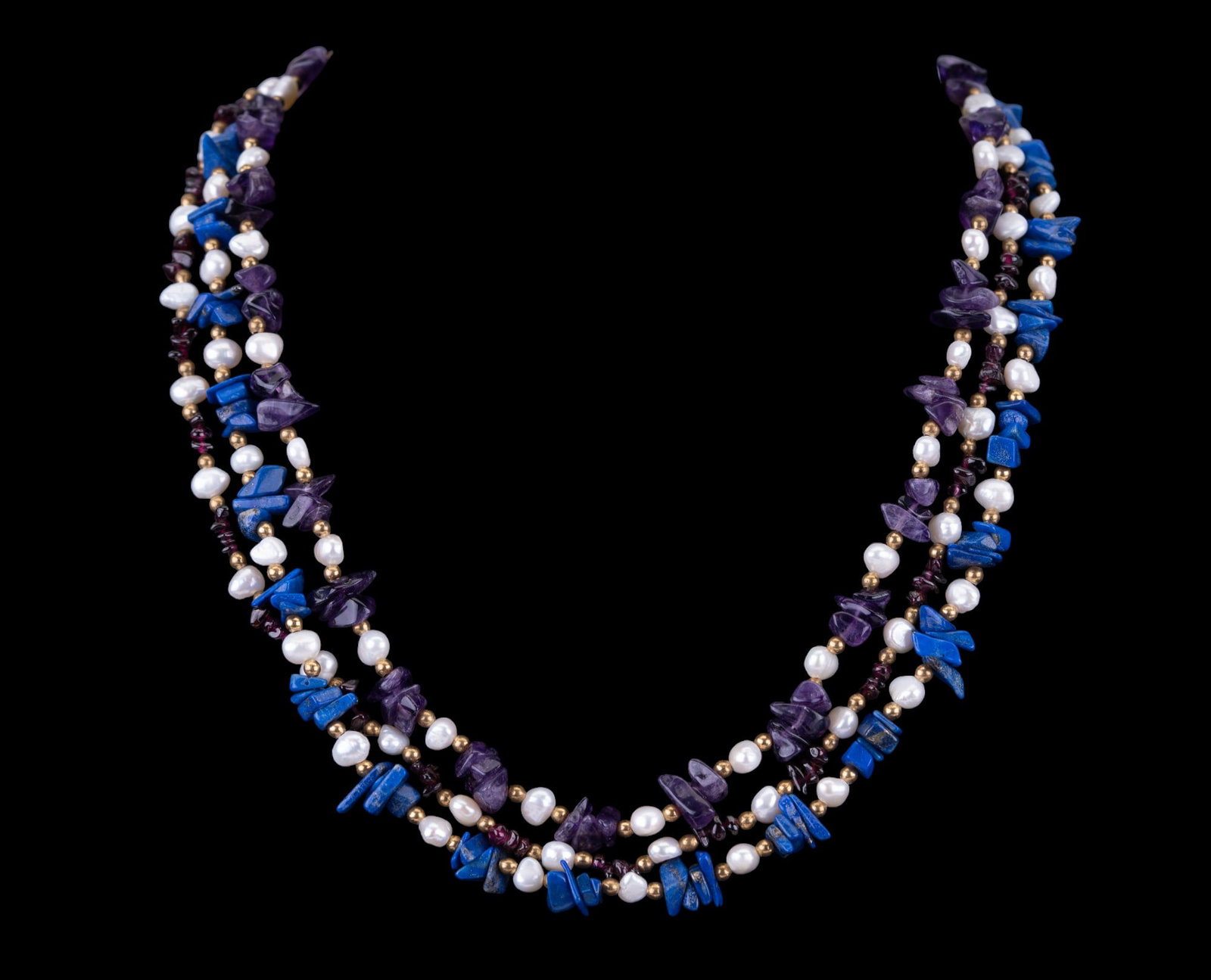 Lapis, Pearl, and Amethyst Necklace: Multi-strand amethyst, lapis, pearl, and garnet necklace.