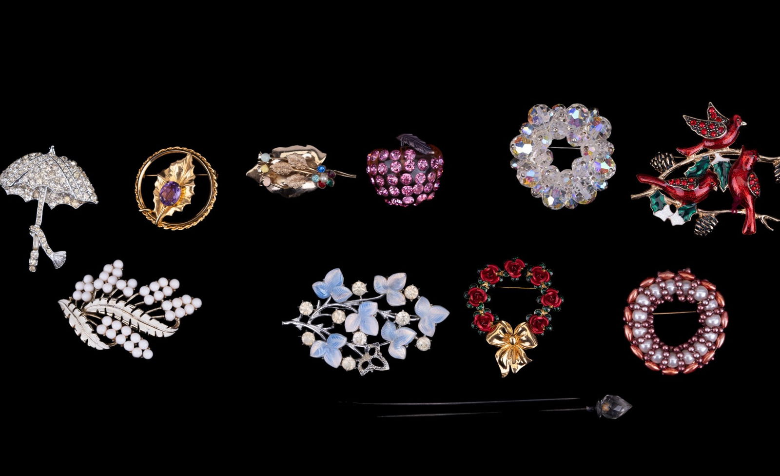 Coro, Rhinestone, Hat Pins, & more Pins: Grouping of pins & brooches. A Coro white/blue flower silver tone brooch, rhinestone umbrella brooch, crystal hoop brooch, a white stone brooch, faux pearl hoop brooch, three vintage/semi-antique hat