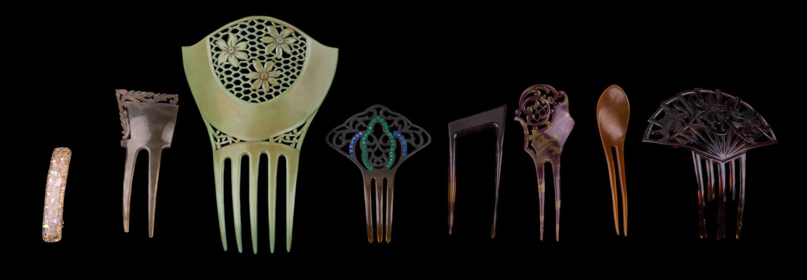 Vintage Celluloid, & other Hair Combs (7): Vintage celluloid & other hair combs, of various sizes. Largest haircomb measures approx. 8" top to bottom. Some amber celluloid hair combs, one thought to have been made from natural material.