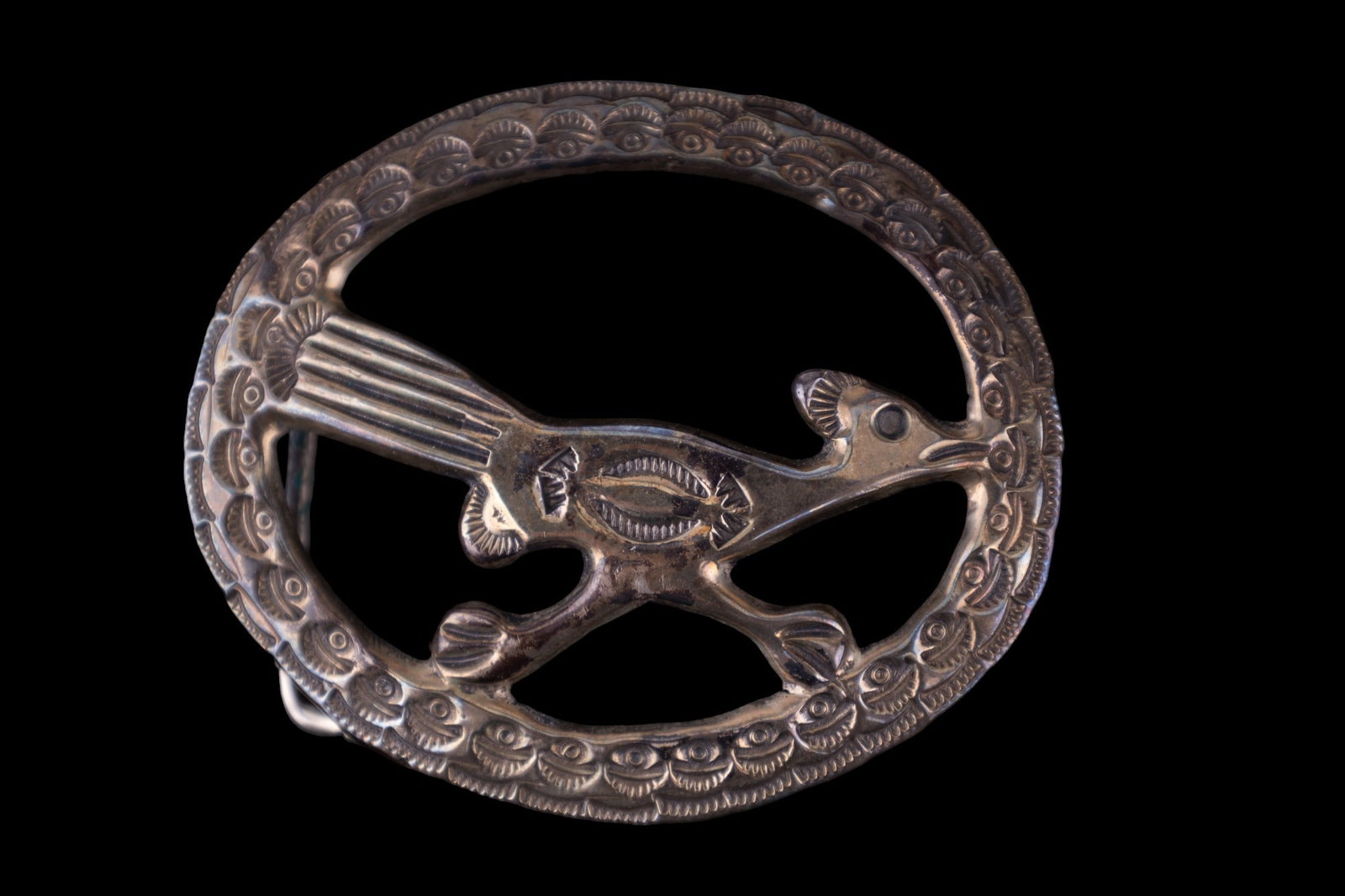 Native American Silver Belt Buckle: Early vintage Native American sterling silver unmarked hand-wrought road runner buckle. Measures approx. 2.7" across.