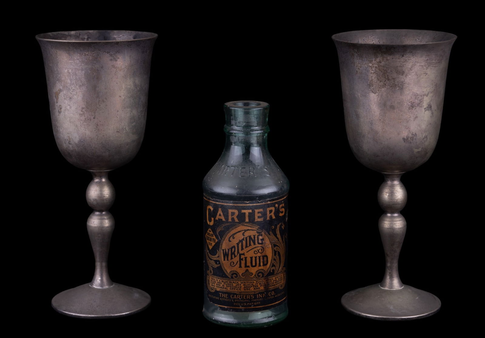 Carter's Writing Fluid Bottle & Vintage Goblets: The Carter's Ink Co. Writing Fluid bottle w/ original label approx 6.25" tall. Most of the label is still present on blue-tinted bottle & the writing is legible. There are also 2 vintage silver-plated