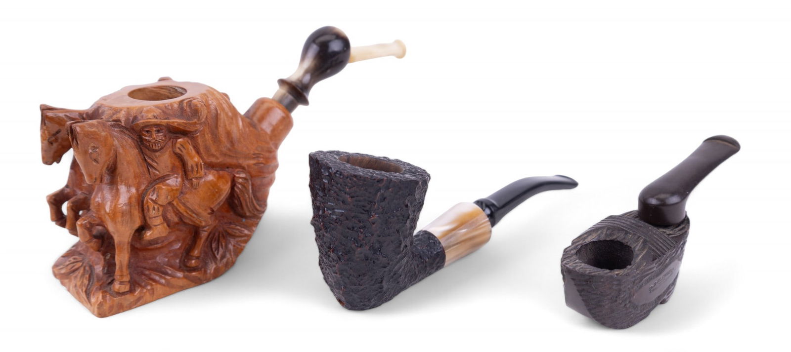 Vintage Estella, Garantie & Old Flanders Pipes (3): 3 vintage pipes featuring a Savinelli Estella 99 non-pareil Italy rustic pipe, a carved horse and rider pipe Bruyere Garantie, and an Old Flanders imported Briar wooden shoe/sabot folding pipe. Longes