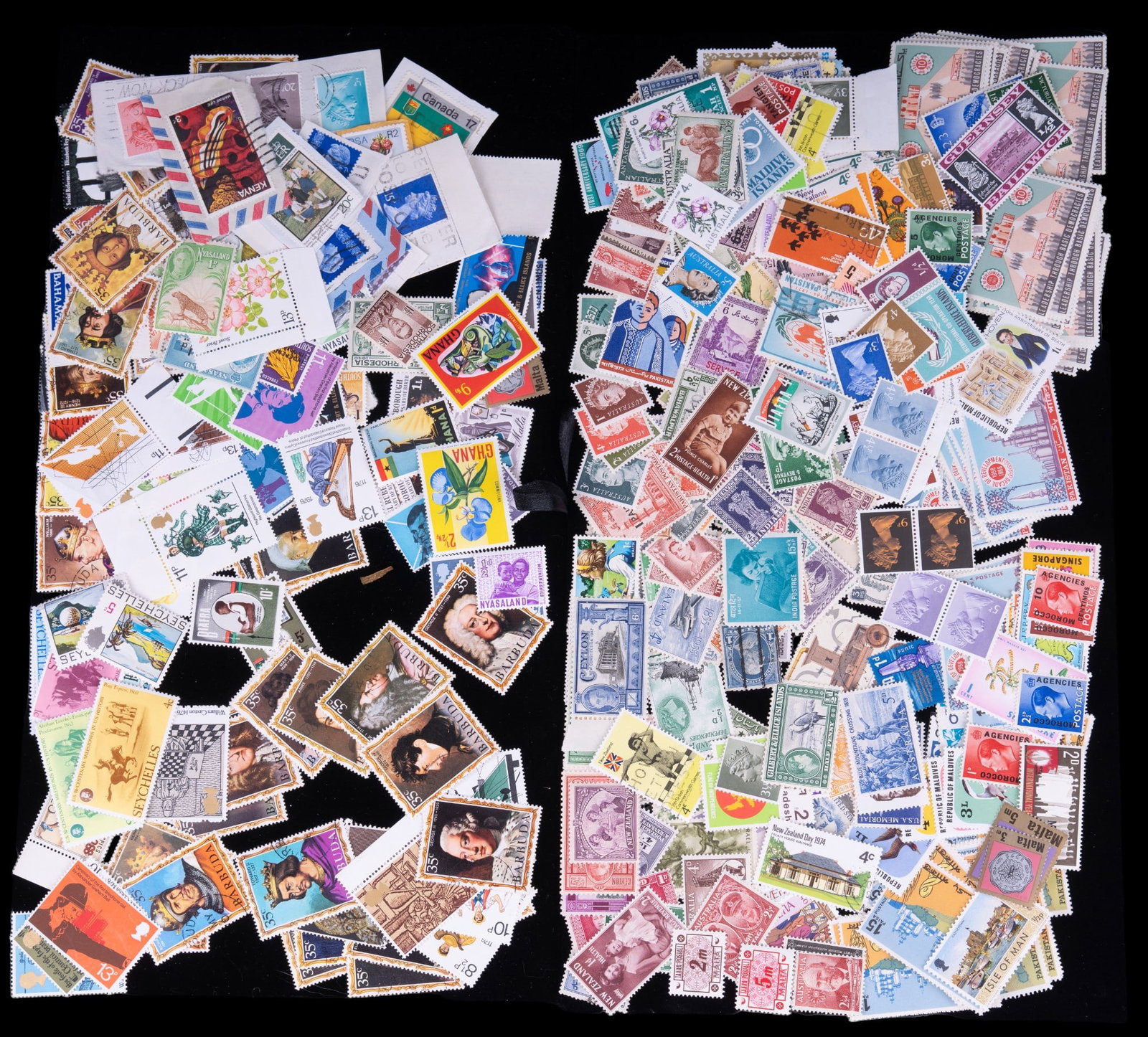 Vintage Uncirculated International Stamps (300): Approximately 300 vintage uncirculated with some antique used stamps. Countries of Origin include: Barbuda, Federation of South Arabia, Wales & more.