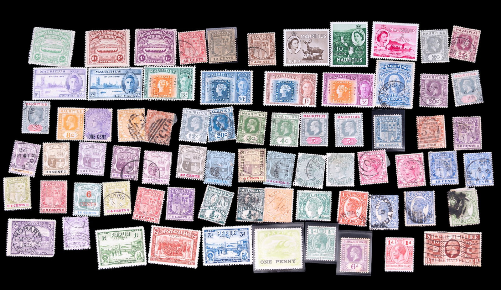 Antique/Vintage British Colonial Stamps (73): Stamps from the former colonies of: Soloman Islands, Mauritius, Queensland, Gilbert & Ellis Islands, Papua, Tasmania, and New South Wales. Stamps are in varying conditions as seen in photography, as w