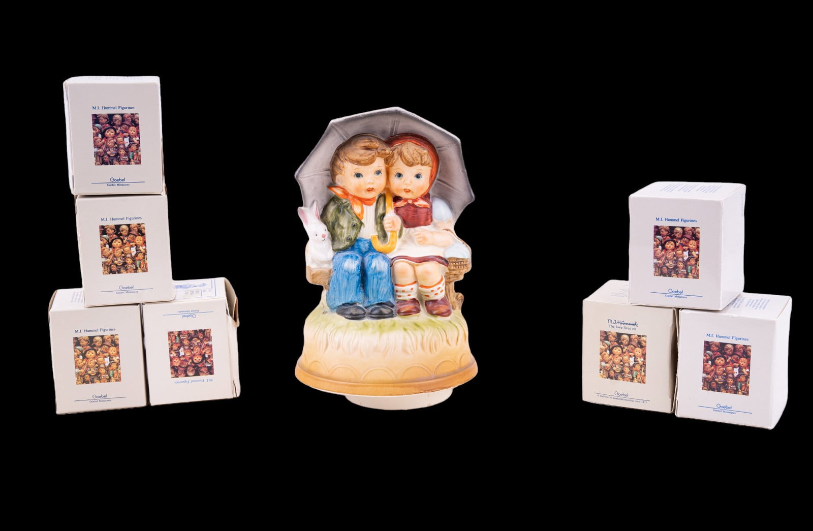 Goebel Hummel Miniatures First Edition (7) + Music: First Edition Goebel Hummel Miniatures. Set includes 7 figurines - Busy Student, Accordion Boy, Baker, We Congratulate, Visiting an Invalid, Doll Bath, & Merry Wanderer. All come in original box & pai