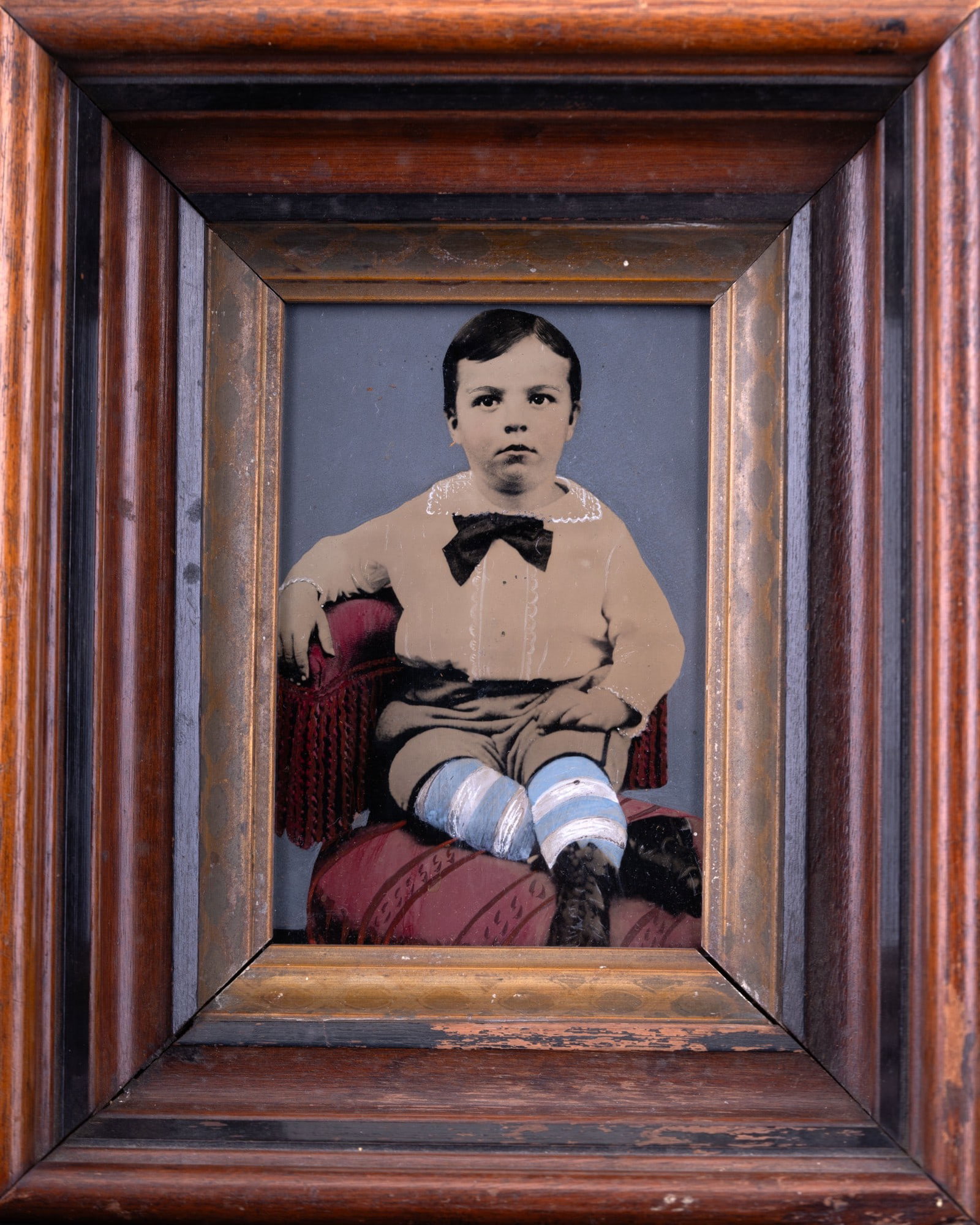 Antique Colored Tintype Photo: Half-plate tintype photo of a boy, framed in a walnut shadow box. Tintype has photo color & hand-tinting color combination. This could possibly be an ivorytype photo. Frame measures approx 8"x10". Ima