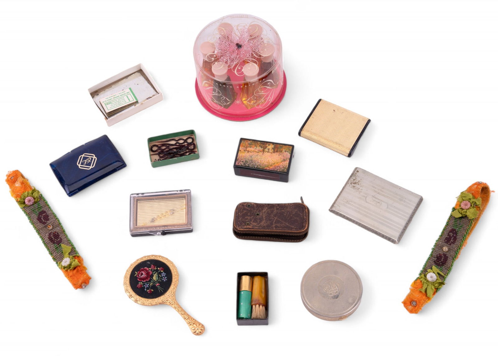 Vintage Ladies Compacts, Perfumes, & Garters: 2 compacts, cigarette case, lacquer box of matches, 2 small mirrors, 2 garter belts, 3 perfume items, key holder, box w/ shell hair pins, & 2 lipstick items.