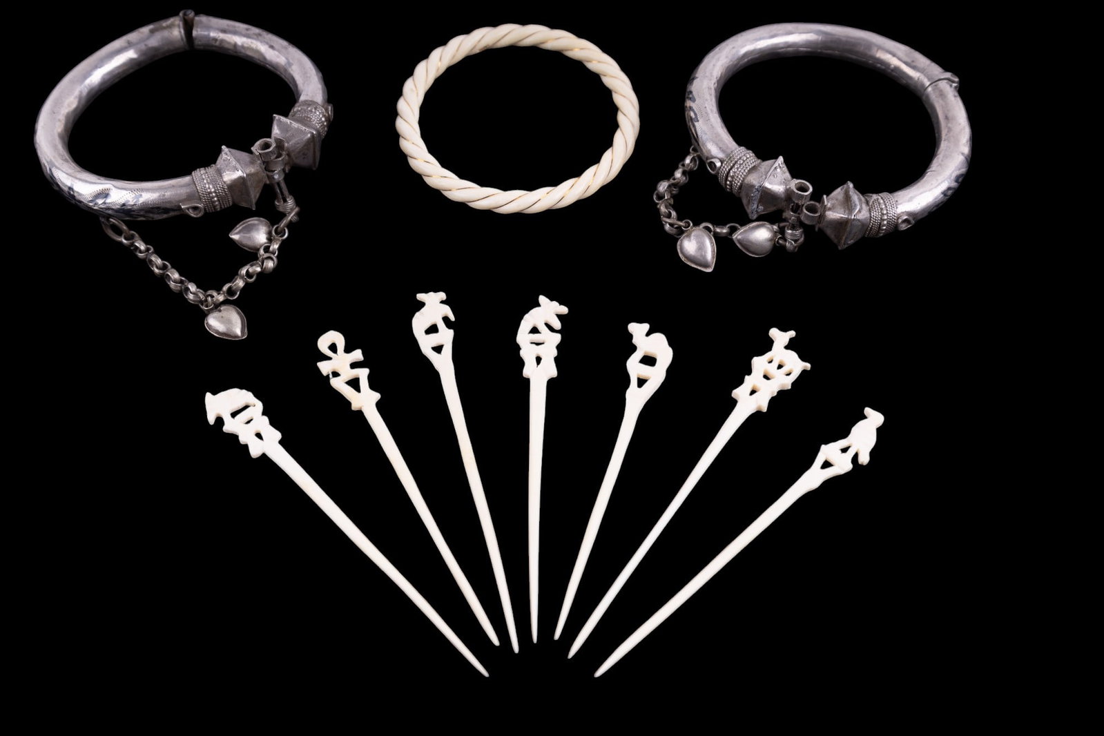 Carved 14k Wired Bangle & Cocktail Picks + Bangles: Natural carved bone/natural material twisted bangle bracelet w/ 14k gold wire accent approx 3" in diameter (marked "14k 585" on the interior), 7 total carved bovine bone cocktail picks of Egyptian ani
