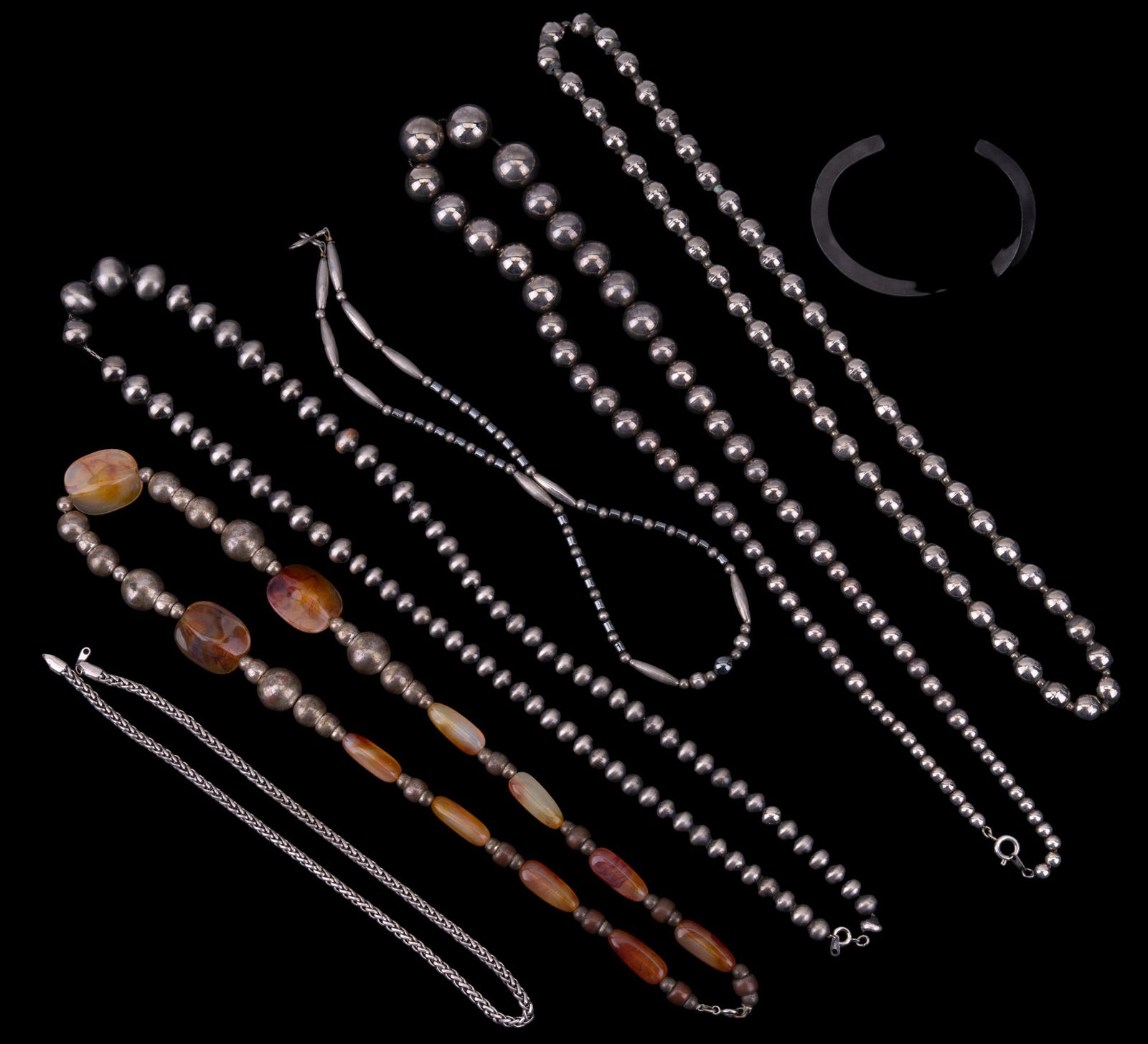 Silvertone Bead Necklaces & Iron Cuff: 2 bead necklaces marked "Korea", unmarked bead necklace, bead & carnelian agate necklace, unmarked graduated bead necklace, chain necklace & steel (wrought iron twisted) cuff bracelet. Longest necklac