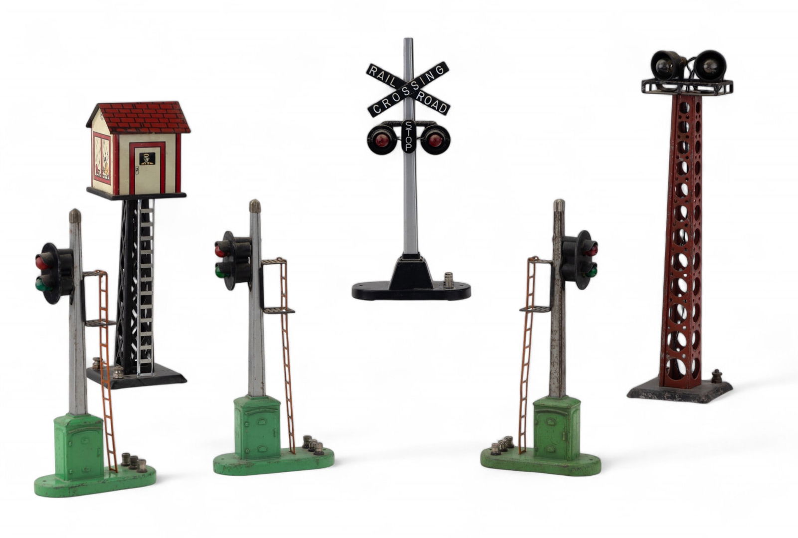 Vintage Lionel and Marx Train Signals (6): Vintage Lionel and Marx train layout accessories including a crossing signal, 4 track switch lights, and litho control tower. Pieces have wear, oxidation, and paint loss.
