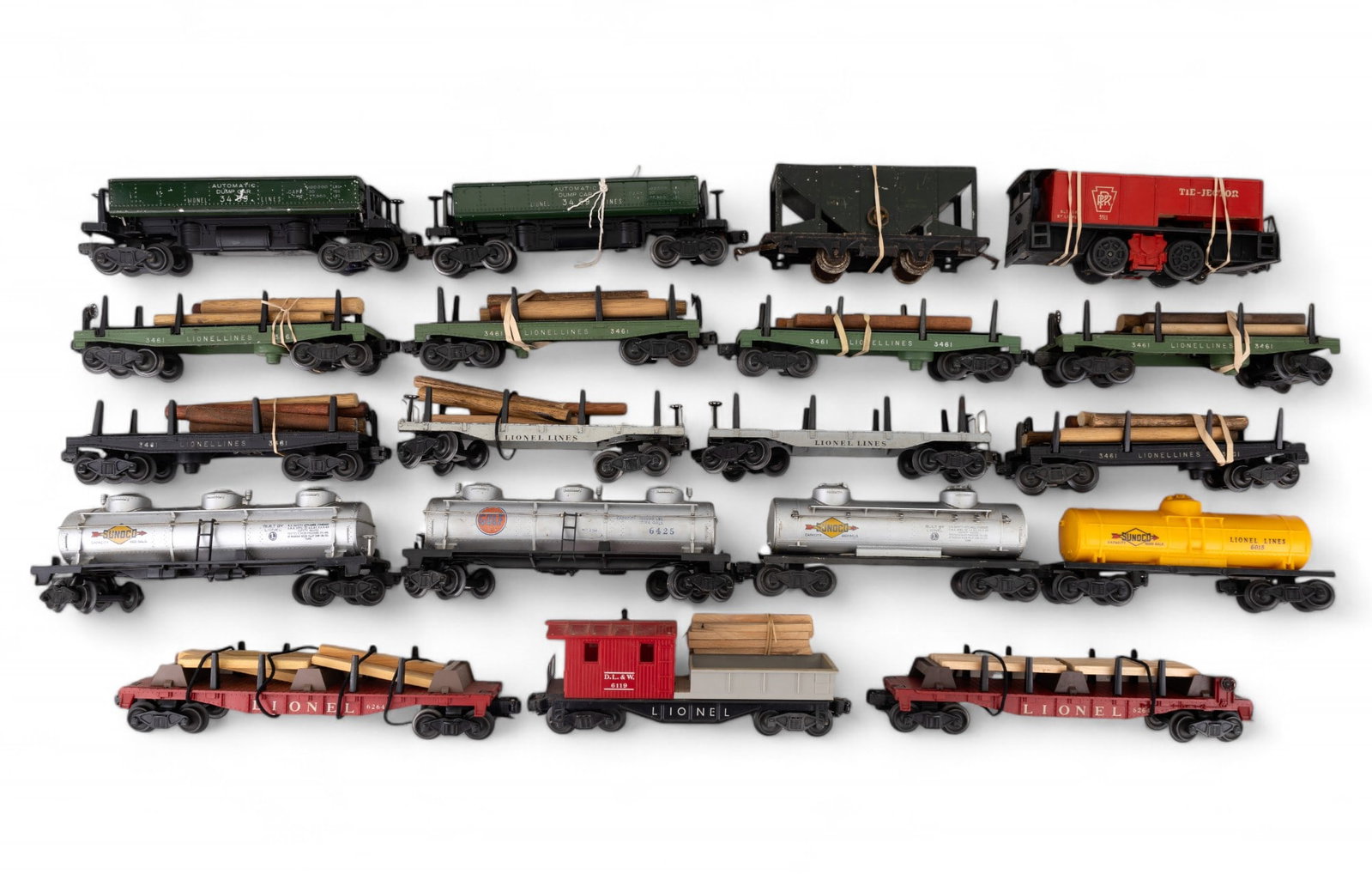 Lionel O Gauge Wood Carriers, Tankers, & Others: 19 total Lionel O gauge cars, including 2 dump cars, 13 flatcars for carrying wood or other items (1 flatcar needs wheel repair), 3 Sunoco tankers, & a Gulf tanker.
