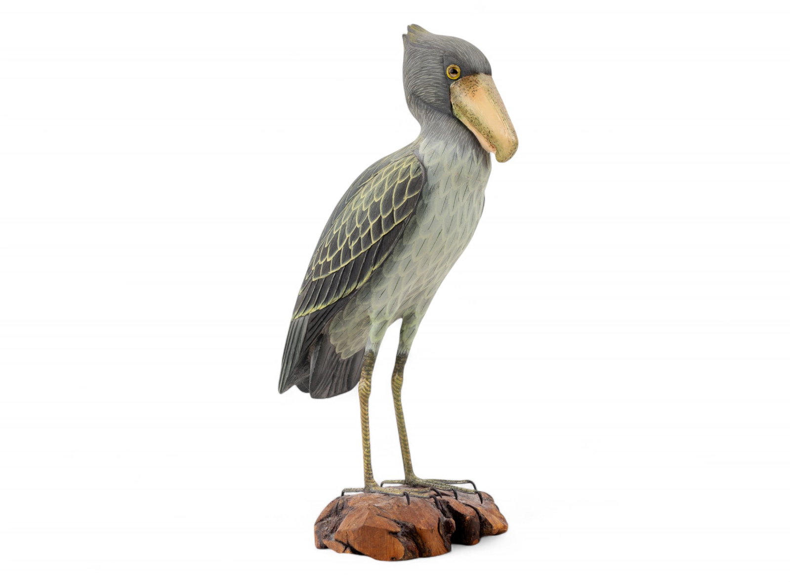 Hand Carved & Painted Shoebill Stork: Unsigned carved and painted shoebill stork with glass eyes and painted wire legs mounted on a wood burl. Measures approx 12.25" H x 7" W.