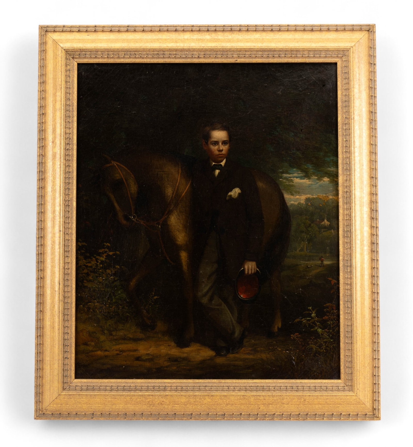 19th C Oil Painting of Boy and Horse: 19th century oil on 15" W x 18" H canvas depicting a boy and horse with some craquelure in contemporary frame measuring approx. 19" W x 22" H OD. No signature found but hand written label on reverse w