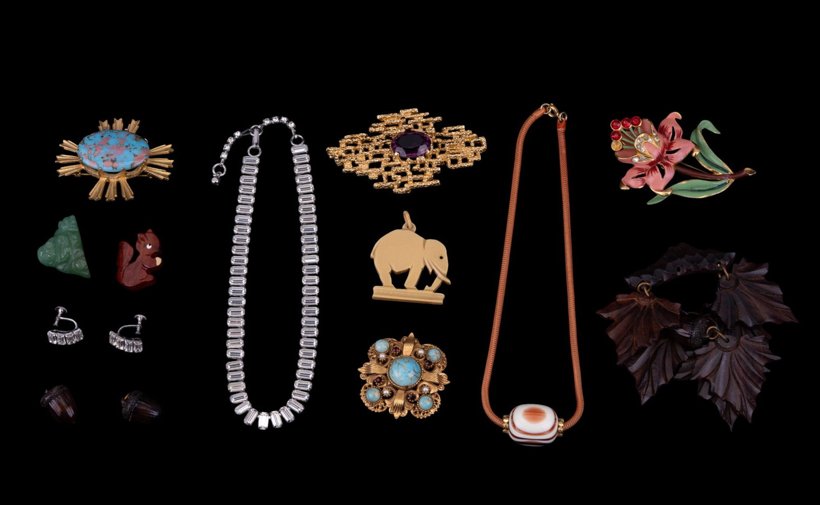 Vintage Brooches and Necklaces: Carved wood leaf and acorn brooch, small carved wood squirrel pin, Coro vintage flower brooch missing red rhinestone, brooches from Panetta, Vans Authentics, and Florenza. Rhinestone silver tone neckl