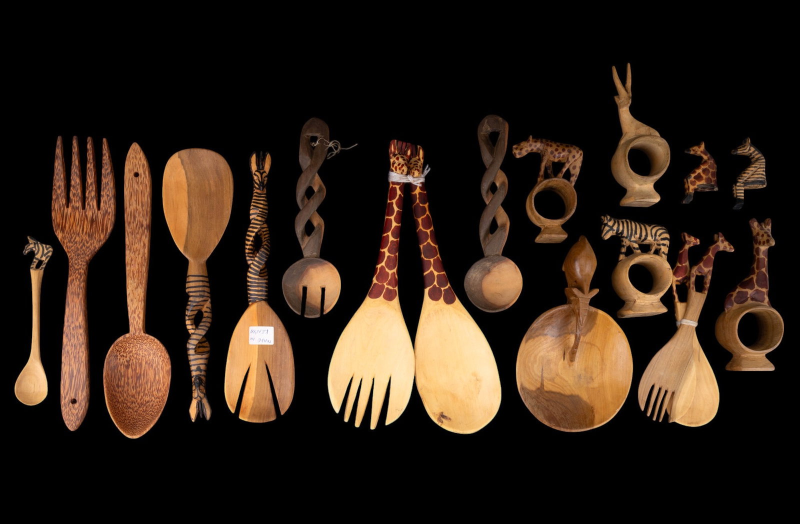 Kenyan Carved Wood Kitchen Utensils: A collection of carved wood animal themed napkins serving spoon and spork sets.