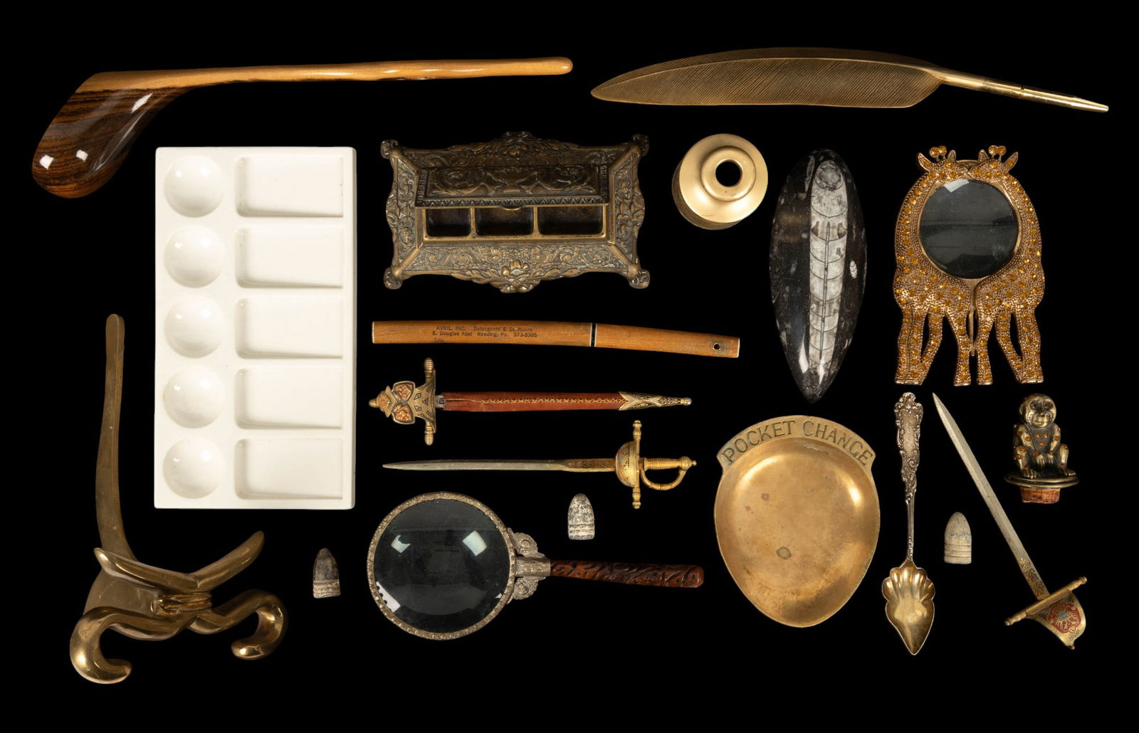 Vintage Brass Desk Items, Fossil, Sterling: Ornate brass early vintage stamp holder, ceramic ink palette, brass feather pen, polished Orthocera fossil, miniature sword and katana letter openers, vintage magnifying glass with carved wood handle,