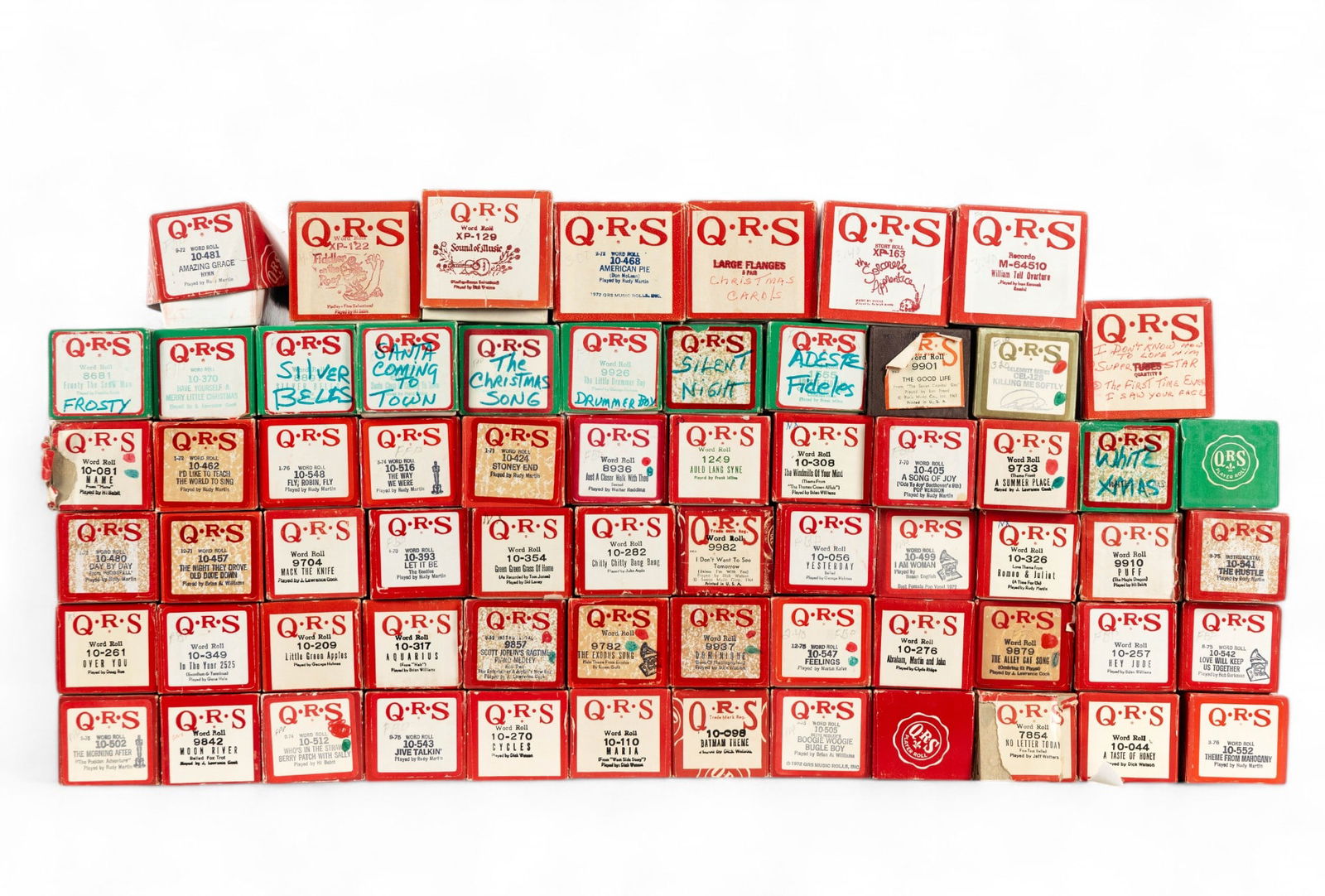 QRS Player Piano Word Rolls: A collection of 67 QRS word rolls for player piano, 10 of which are Christmas songs and 8 are larger rolls.