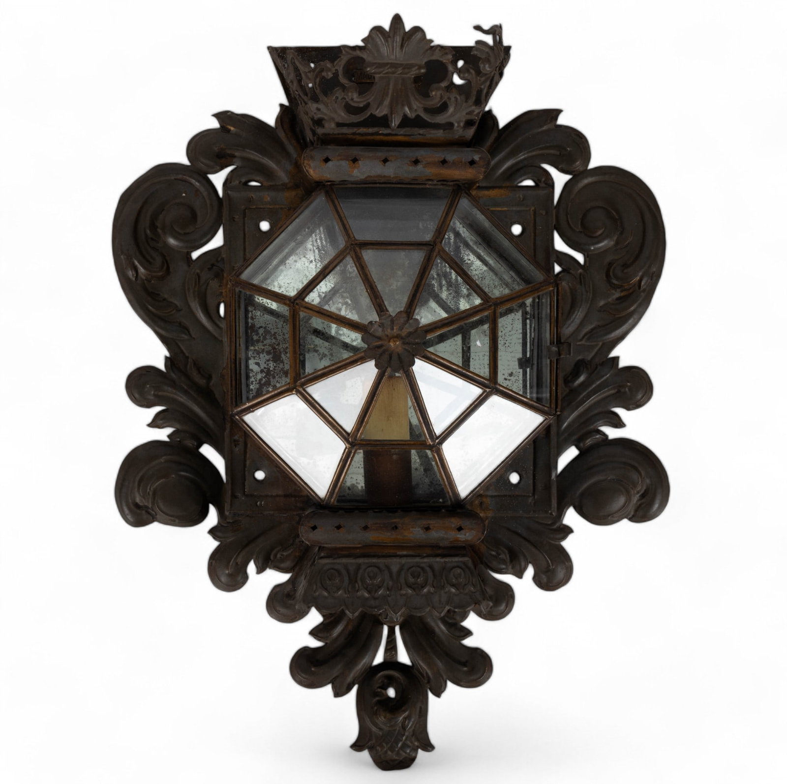 Spanish Tin Mirrored Sconce: Electric tin mirrored sconce marked "Made in Spain" with loss, wear, and oxidation. Wiring has been cut from socket. Sconce measures approx.17.5" W x 23.5" H x 7" D.