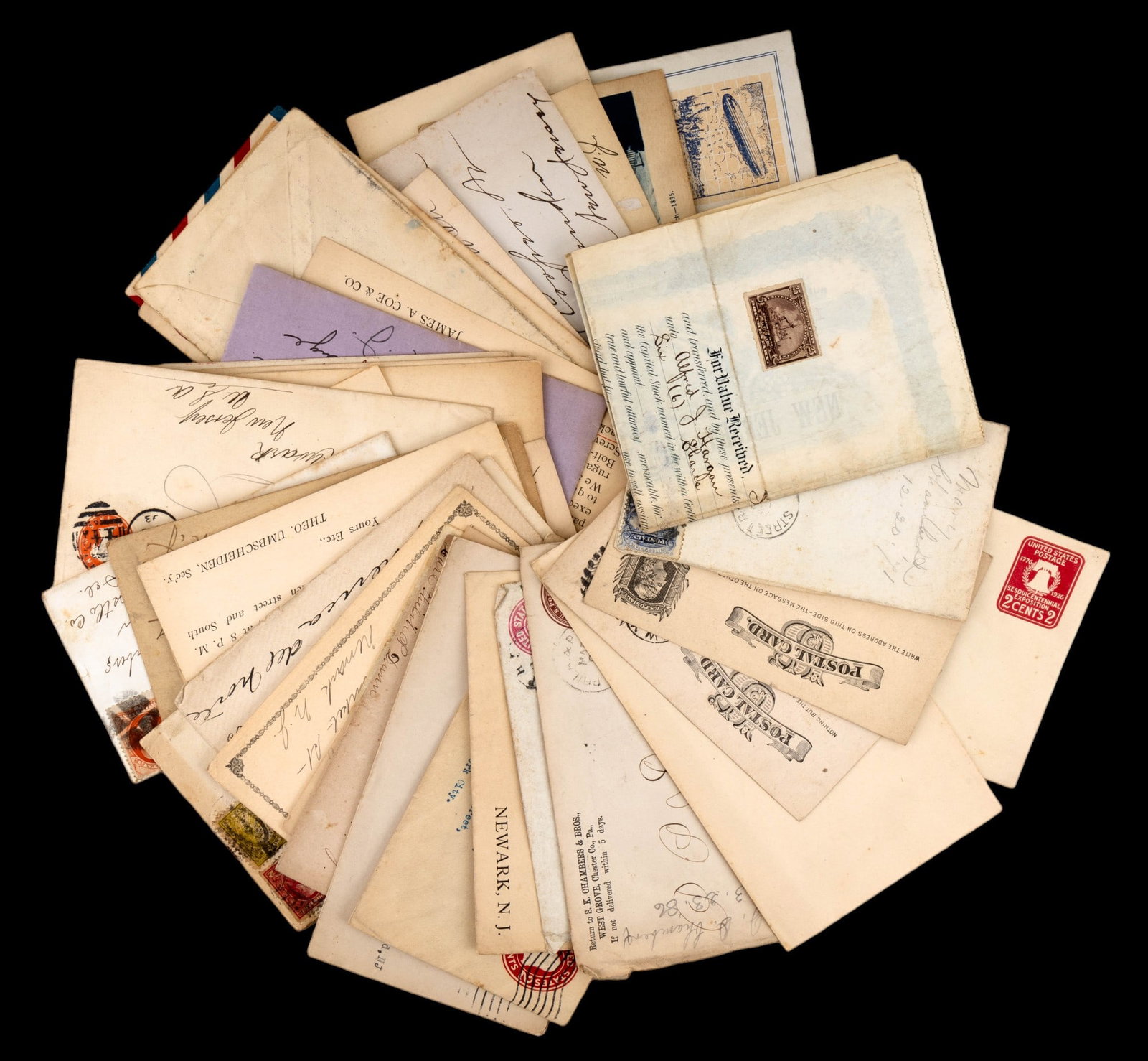 Antique Postal Ephemera: A collection of canceled and non-canceled postage envelopes and postal cards, circa 1890s to 1920s.