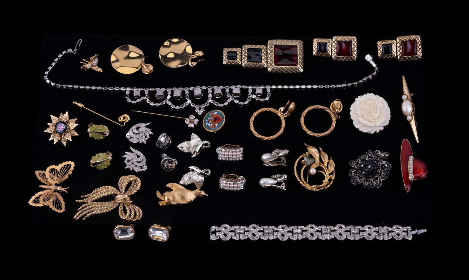 Designer and Vintage Jewelry: Designer Monet, gold tone, various silver tone brooches, earrings, rhinestone crystal bib style necklace with bracelet, and more.