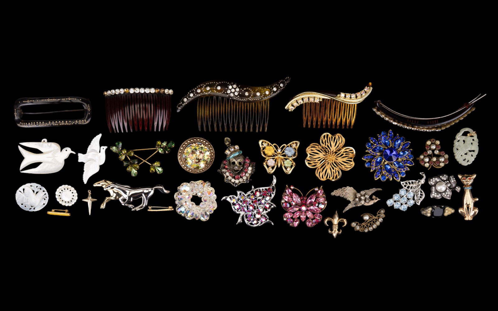 Vintage Brooch & Hair Comb Assortment (31 Pcs): 24 total brooches & pins, including Regency, Monet, Liz Claiborne, Sarah Coventry, & Trifari. Fleur-de-lis pin is 12K gold filled. Etched dove mother-of-pear brooches & pendant are inscribed "Bethlehe
